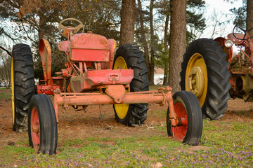 Obraz premium old red tractor in the woods