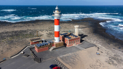 Aerial view of the lighthouse of El Toston on the north coast of Fuerteventura in the Canary...