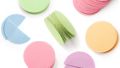 Creative layout made of wafers of different flavours and colours (pink, purple, green, blue, yellow) on the white background. Flat lay. Food concept. A typical sweet of Mexico and Latin America.