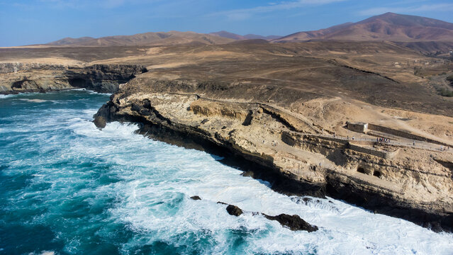 Aerial view of the sea caves of Ajuy, dug out of limestone cliffs on the western coast of Fuerteventura in the Canary Islands, Spain -