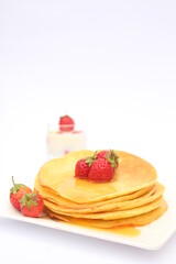 Strawberry pancake with cream and chocolate