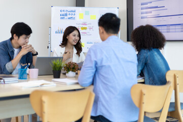 Young people meeting to discuss successful business projects in the office. Human relations and working with colleagues in the organization happily.