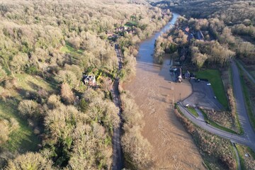 Flooded fields and houses river Severn in Ironbridge England drone aerial view.