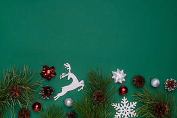 Christmas, winter layout on a green background. Concept of christmas, winter, new year. Flat lay, top view. Copy space.