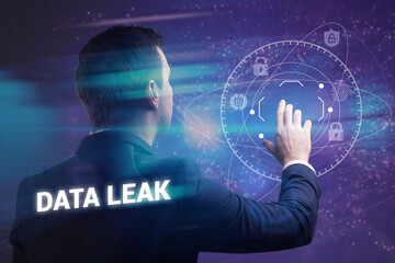Business, Technology, Internet and network concept. Young businessman working on a virtual screen of the future and sees the inscription: Data leak