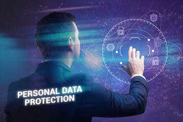 Business, Technology, Internet and network concept. Young businessman working on a virtual screen of the future and sees the inscription: Personal data protection