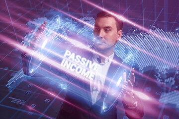 Business, Technology, Internet and network concept. Young businessman working on a virtual screen of the future and sees the inscription: Passive income