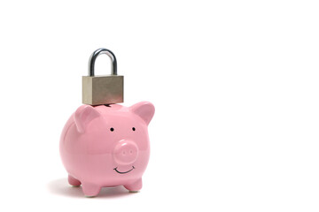 Pink piggy bank and a lock standing on it on white background.Concept, access finance closed.