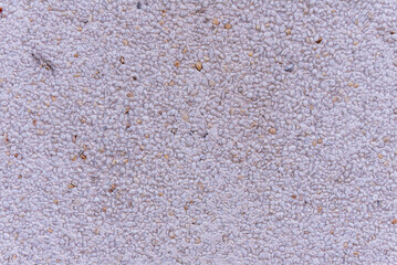 Cement wall with a multitude of stones integrated into the mass. concrete texture vector background