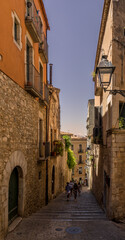 Fototapeta na wymiar Narrow street in Girona, the beautiful medieval city in Catalonia Spain 