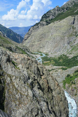 Swiss Alps view . Mounts with white gray clouds sky