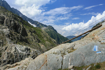 Fototapeta na wymiar Swiss Alps view . Mounts with white gray clouds sky