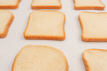 Delicious bread slices isolated on a white background, top view.