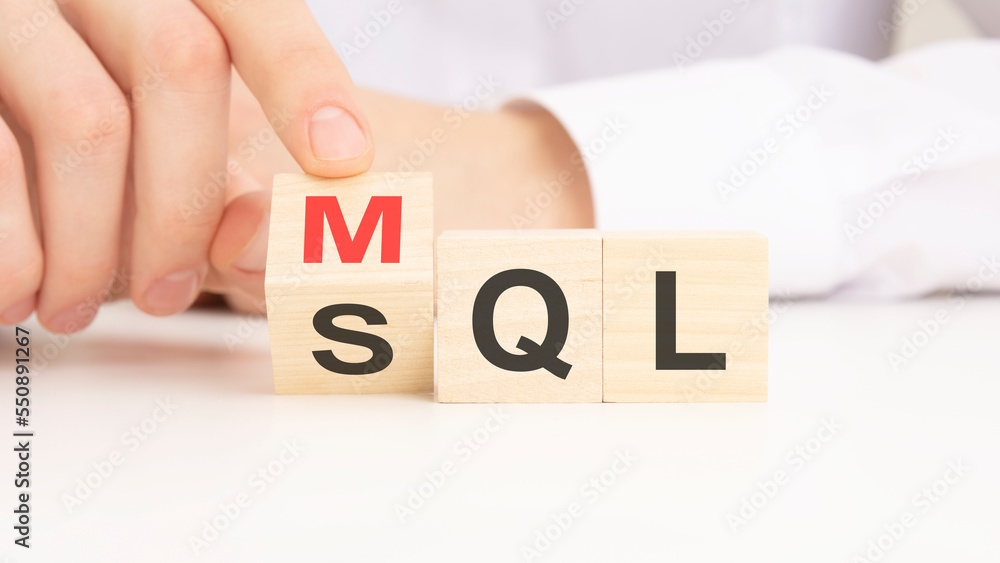 Poster mql or sql symbol. businessman turns cubes and changes words 'mql marketing qualified lead' to 'sql 