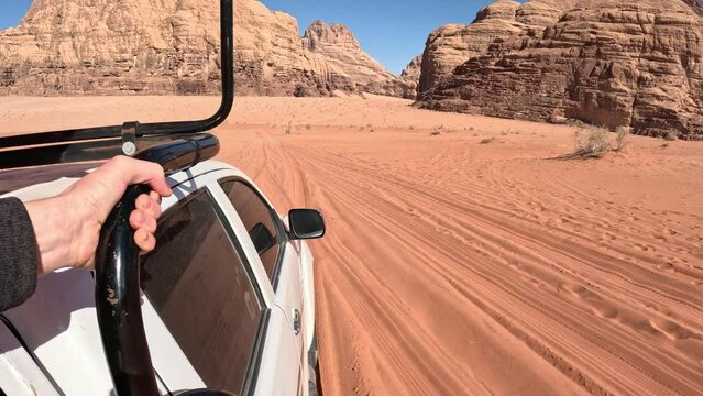 POV shot from a 4x4 car driving in Wadi Rum valley, Jordan