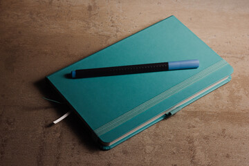 Blue notepad with pen. High quality photo