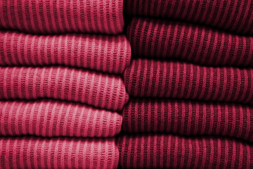 Handmade yellow knitting wool texture background. New 2023 trending PANTONE 18-1750 Viva Magenta...