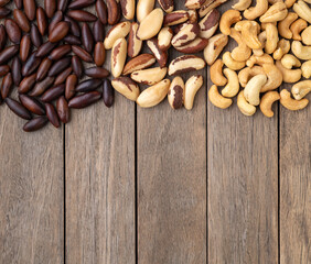 Brazilian nuts over wooden table with copy space. Brazil,  cashew and baru nuts