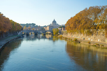 Fototapeta na wymiar Tiber River near Prati district in Rome, Italy. Autumn colors dye the trees along the river.