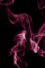 Magenta wisp of smoke on black background. Concept poster of color of the year 2023.
