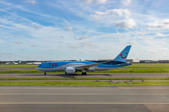 Amsterdam, Netherlands - October 19, 2022: A picture of a Boeing 787-8 Dreamliner TUI plane on the runway.