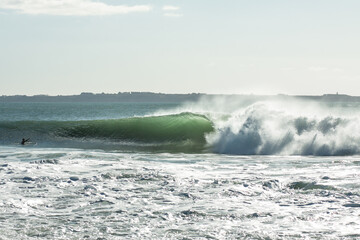 Surfer Riding Powerful Green Ocean Wave