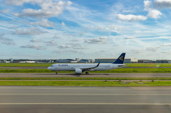 Amsterdam, Netherlands - October 19, 2022: A picture of an Airbus A321 neo Air Astana plane on the runway.