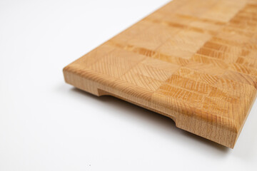 Endgrain wooden cutting board isolated above white background
