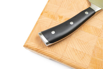 Black handle of kitchen cooking knife on the wooden board