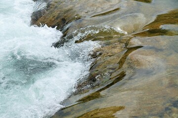 Fresh clean water from the river with stone