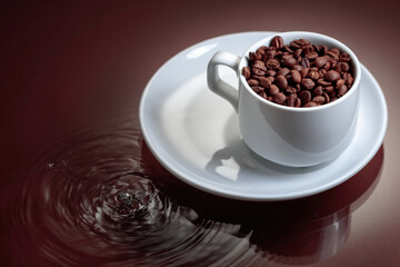 Cup with coffee beans on a brown background.
