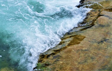 Fresh clean water from the river with stone