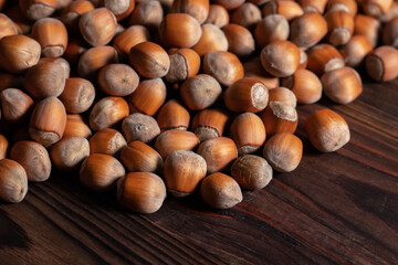 Close up brown hazel nut on wooden desk. Healthy organic vegetarian snack hazelnut. Background