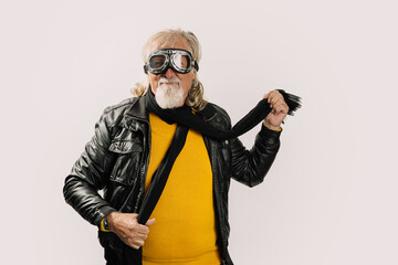 Positive senior rocker in glasses on white background