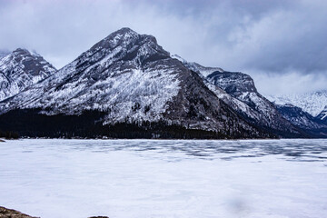 Ice is still frozen on Lake Minewnaka. Banff National Park, Alberta, Canada
