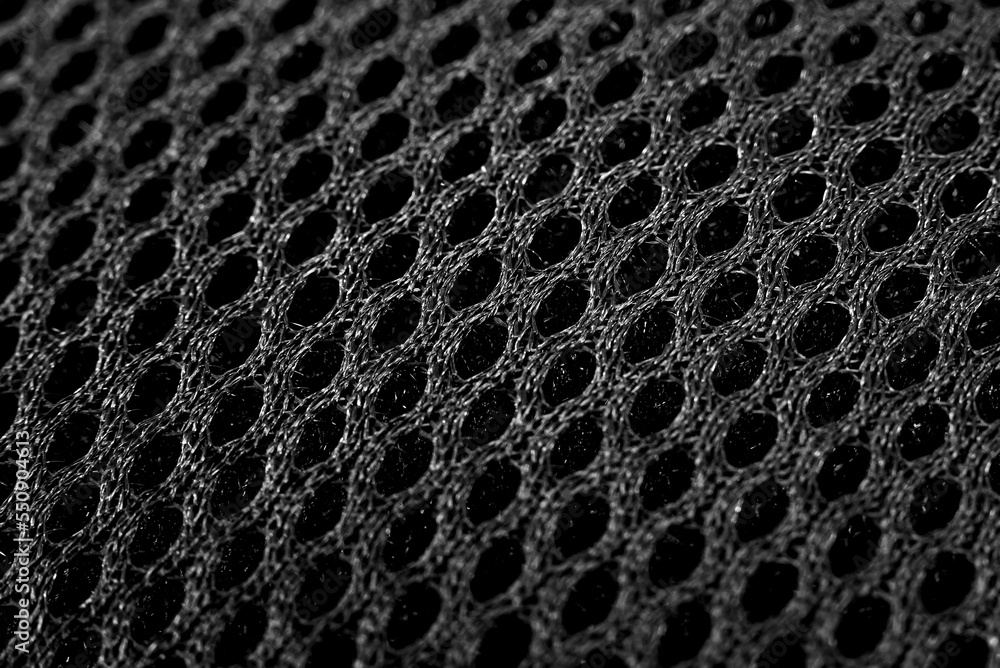 Sticker The texture of the mesh fabric in black color close-up. Grid