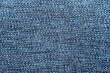 Close-up long and wide texture of natural blue fabric or cloth in light blue color. Fabric texture of natural cotton or linen textile material. Blue canvas background