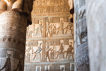 Interior details of ancient temple with ornamental columns and doors
