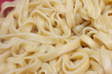 cooked tagliatelle. tagliatelle texture. tagliatelle details.