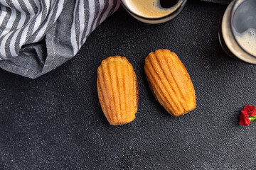 Madeleine biscuit cookies sweet dessert delicious snack healthy meal food snack on the table copy space food background rustic top view