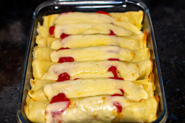 Traditional salty  pancakes stuffed with ground beef, cheese and sauce. Portrait