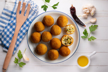 Recipe for arancini with zucchini in a small format similar to a Spanish tapa crequette.
