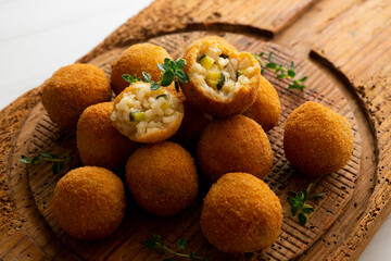 Recipe for arancini with zucchini in a small format similar to a Spanish tapa crequette.