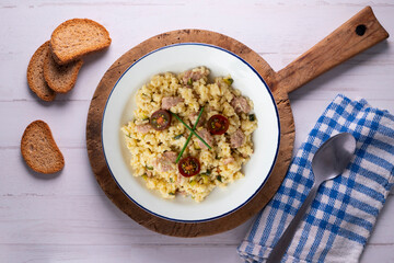 Italian risotto recipe with sausage and zucchini.