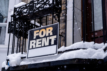 For rent sign posted in front of front porch