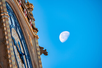 Close up view of the Big Ben clock tower with a moon in the background. Amazing details after...