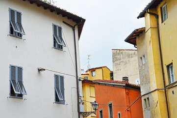 Fototapeta na wymiar Terracotta house on the corner streets of Sapiti and Sprone near