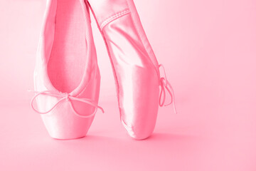 Pink pointe shoes for ballet close-up on a pink background. New 2023 trending PANTONE 18-1750 Viva Magenta color. © Алекс Ренко