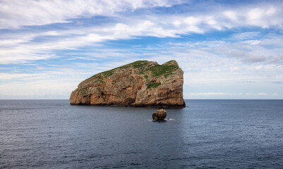 Fototapeta na wymiar View of Rocky Coast with Cliffs on the Mediterranean Sea. Regional Natural Park of Porto Conte, Sardinia, Italy. Nature Background.