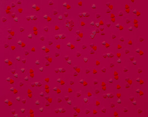 Pattern from hearts in shades of magenta. Color of the Year 2023. Festive Template of greeting card or packaging design. 